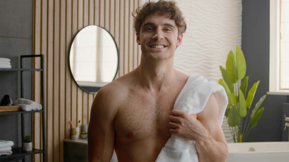 Man washing his intimate area with gentle soap, illustrating proper male intimate hygiene.