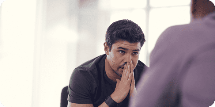 Man reflecting on mental and intimate health, symbolizing the connection between emotional well-being and male sexual health.
