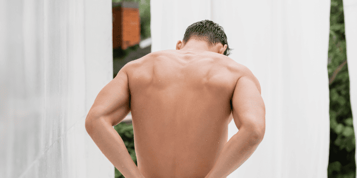 A healthy man engaging in self-care to maintain intimate health, emphasizing the importance of communication and proactive measures.