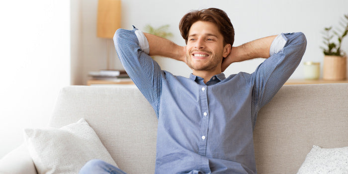 Happy man enjoying wellness and self-care without spending money.