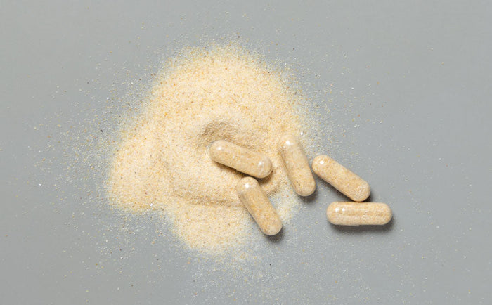 Image showing a person using L-arginine supplements for improving erectile function and sexual health.