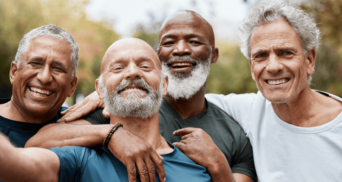 Men over 40 laughing and chatting together