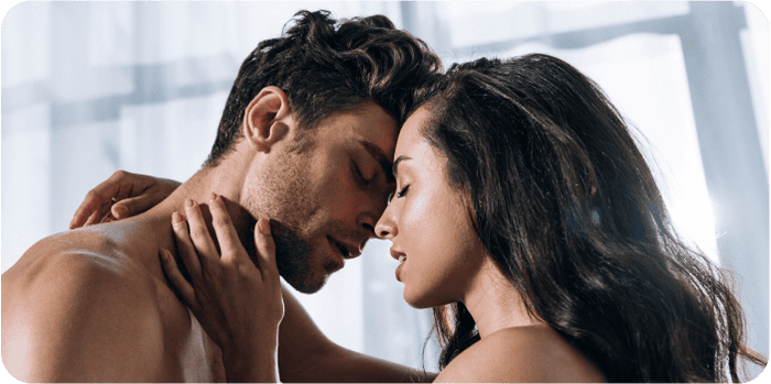 Happy couple emotionally connecting after open communication about masturbation and sexuality.