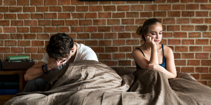 Stressed man holding his forehead with text “stress vs. age” on a neutral background