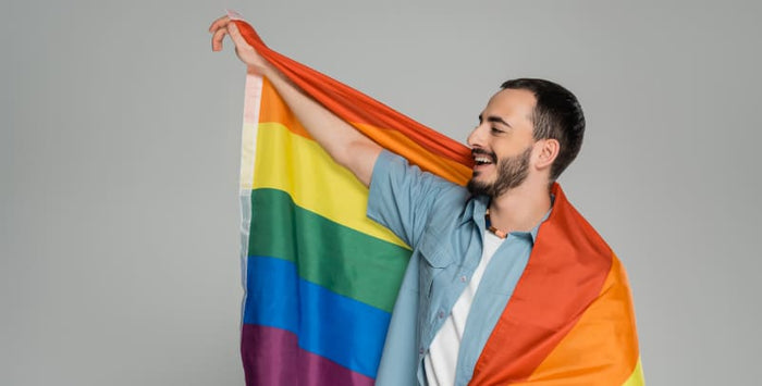 A diverse group of LGBTQI+ activists holding inclusive banners at a pride march.