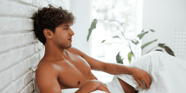 Man practicing breathing techniques to enhance his intimate experience.