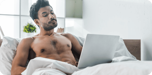 Relaxed man enjoying his sexuality with intimate products for a pleasurable and healthy experience.