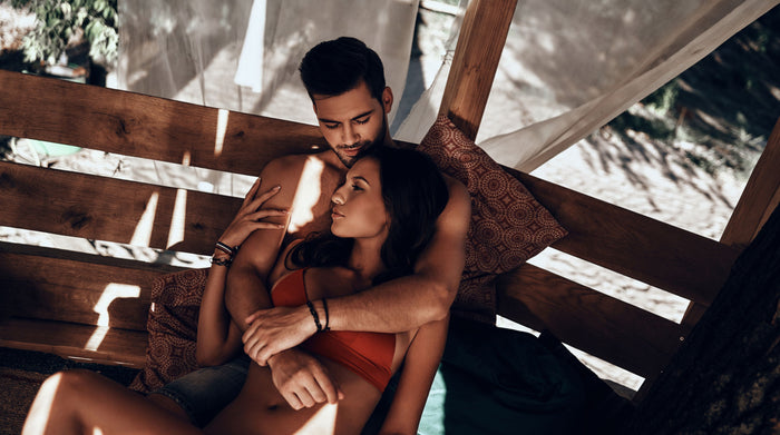 Couple cuddling in intimacy after sex