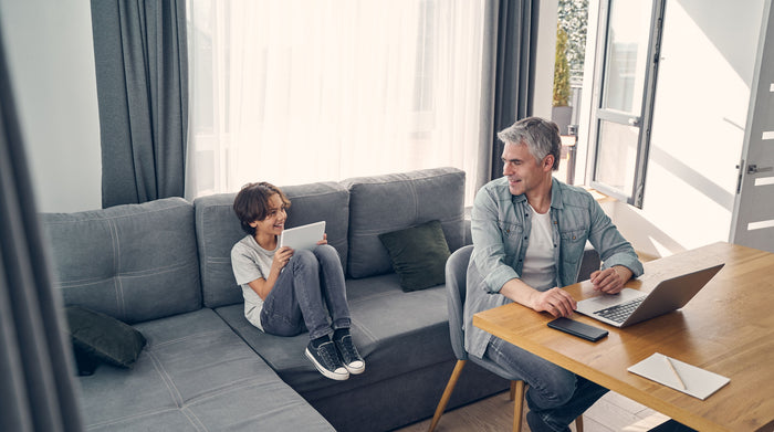 dad and child having a conversation at home