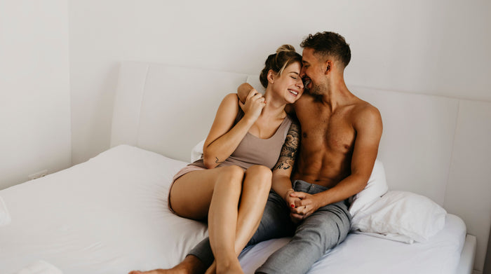 happy and in love young couple in bed