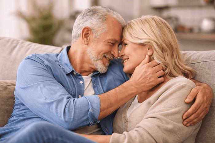 Young adult reflecting on attraction to an older partner in a calm, intimate setting