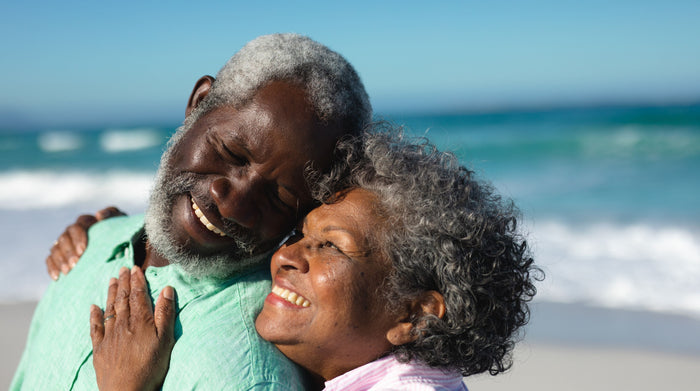 Old couple in love at the beach