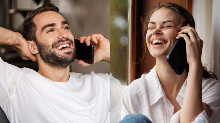 Couple on a video call smiling and holding a mug, staying connected during the holiday season apart